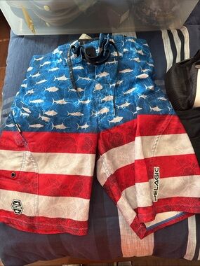Pelagic Red White and Blue Shark-Pattern Swim Shorts
